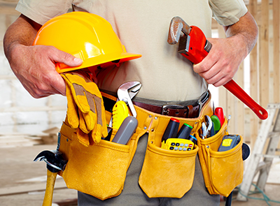 tradesman with tools and hardhat