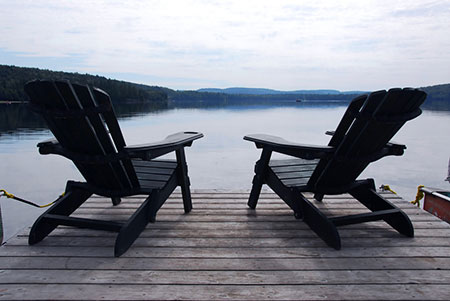 middle age couple sitting together on a bench