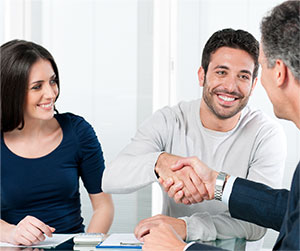 young couple signing a rental lease